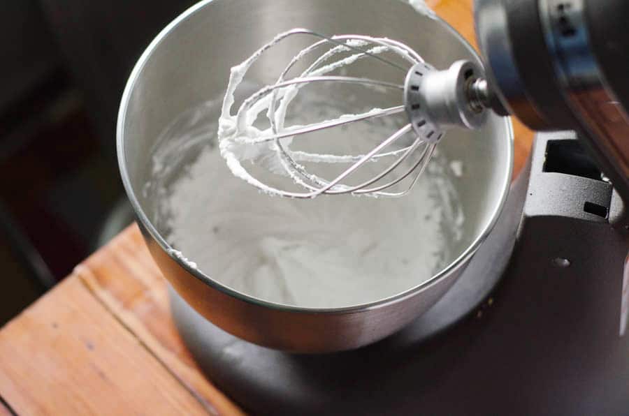 overhead view of stand mixer full of whipped cream