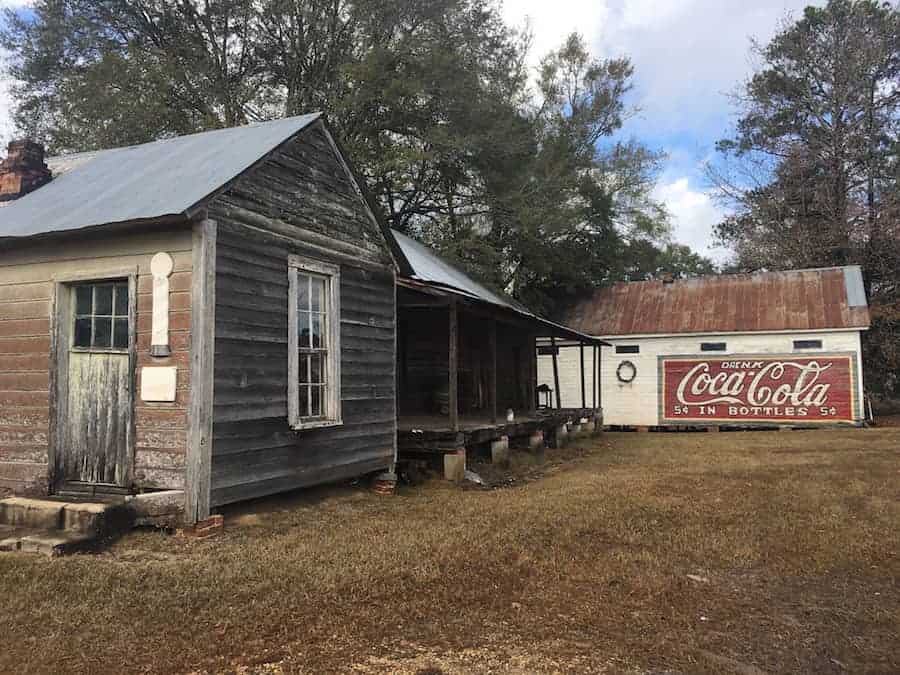 Old wooden building with hand painted Coca Cola sign