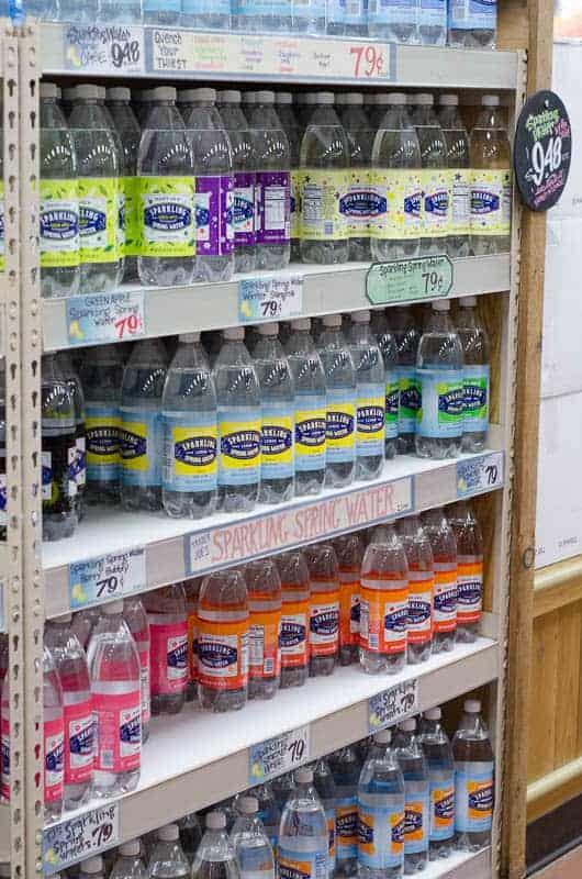 shelf of seltzer water bottles