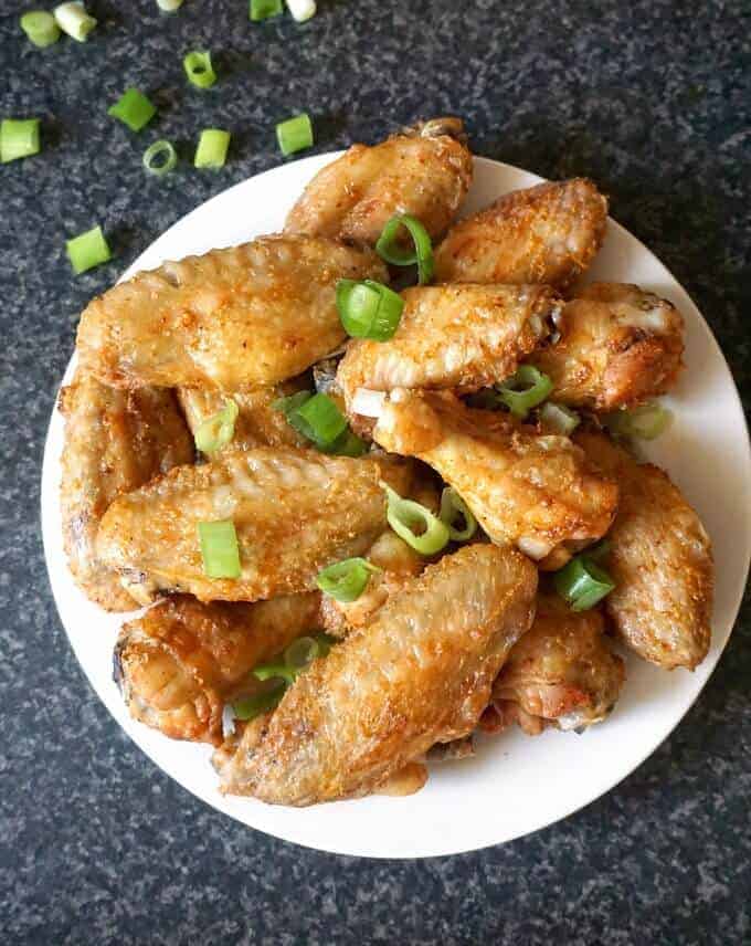overhead view of a plate of crispy plain paleo chicken wings