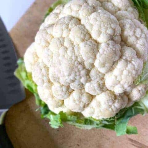 head of cauliflower on a cutting board