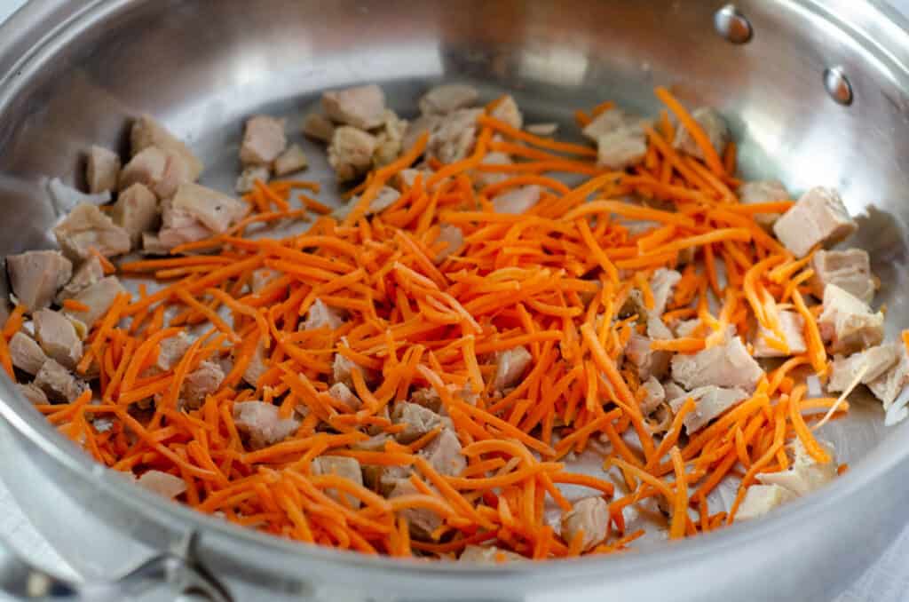 close up of stir fry with chicken and carrots
